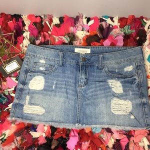 Distressed denim skirt.